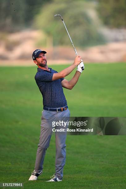 Scott Jamieson of Scotland plays his second shot on the 12th hole during Day One of the Commercial Bank Qatar Masters at Doha Golf Club on October...