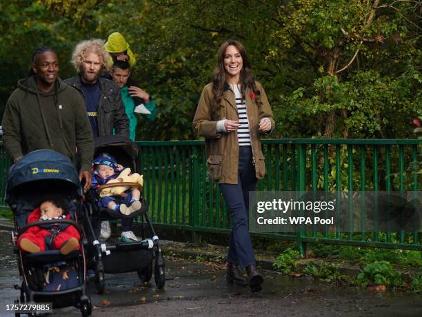 Catherine, Princess of Wales takes part in a Dad Walk in the local park during a visit to "Dadvengers", a community for dads and their children, in...