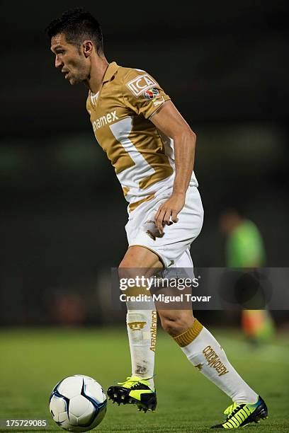 Luis Garcia of Pumas conducts the ball during a match between Pumas and Leones Negros as part of the Copa MX at Olympic stadium, on August 06, 2013...