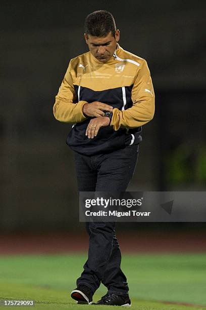 Antonio Torres Servin, head coach of Pumas looks at his clock during a match between Pumas and Leones Negros as part of the Copa MX at Olympic...