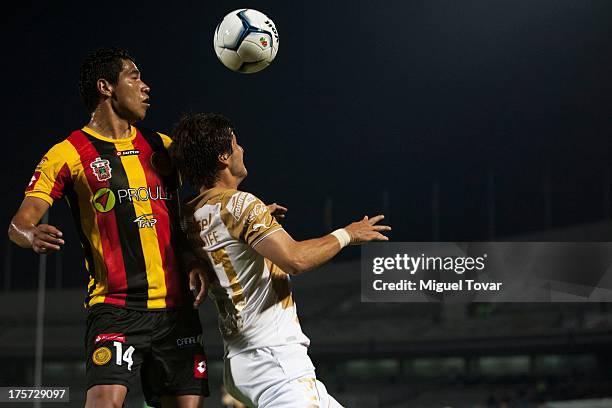 Erick Vera of Pumas struggles for the ball with Wenceslao Diaz of Leones Negros during a match between Pumas and Leones Negros as part of the Copa MX...