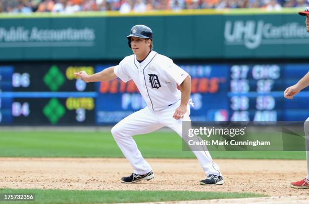 Andy Dirks of the Detroit Tigers leads off first base during the game against the Philadelphia Phillies at Comerica Park on July 28, 2013 in Detroit,...