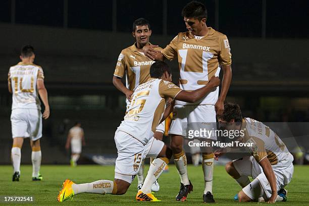 Candido Ramirez and his teammates of Pumas celebrate a goal against Leones Negros during a match between Pumas and Leones Negros as part of the Copa...