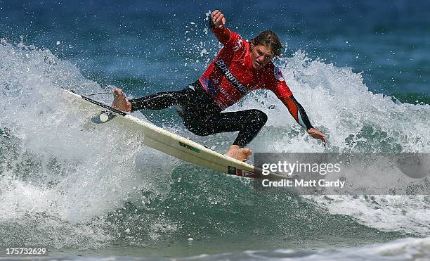 Taz Knight of Great Britain competes in a pro-juniors heat of the Boardmasters pro-surfing competition on Fistral Beach on August 7, 2013 in Newquay,...