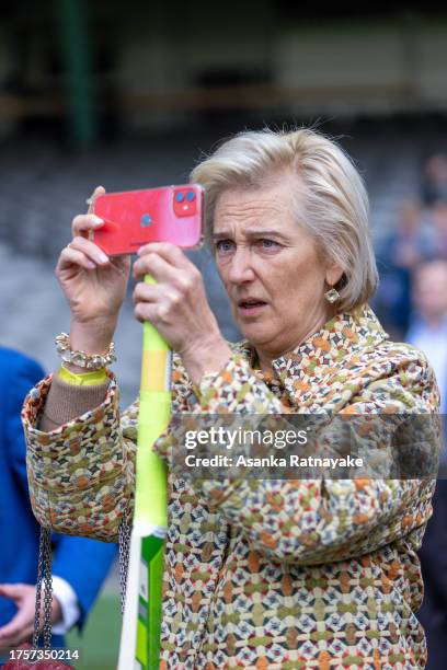 Her Royal Highness Princess Astrid takes a photo while attending a cricket and AFL display at Marvel Stadium on October 26, 2023 in Melbourne,...