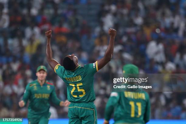 Kagiso Rabada of South Africa celebrates the wicket of New Zealand's Tom Latham during the ICC Men's Cricket World Cup 2023 match between South...