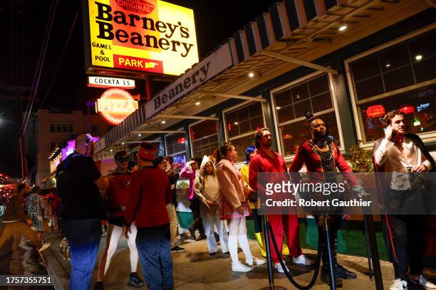 West Hollywood, CA, Tuesday, October 31, 2023 - Costumed revelers wait for a table at Barney's Beanery at the West Hollywood Halloween Carnaval.