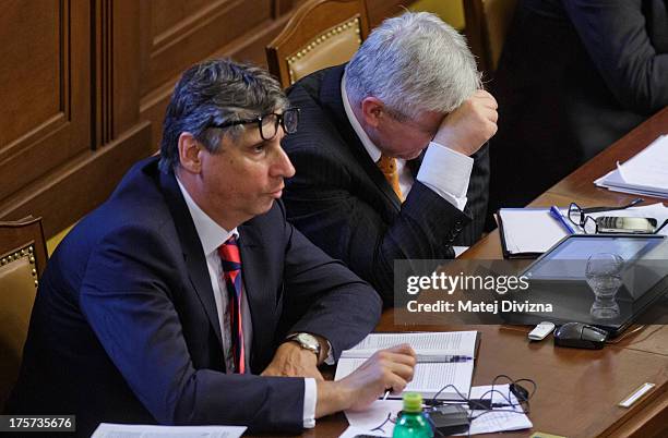 Czech Prime Minister Jiri Rusnok and Czech Finance Minister Jan Fischer attend a confidence vote at the Czech Chamber of Deputies on August 7, 2013...