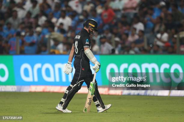 New Zealand's Tom Latham makes their way off after being dismissed during the ICC Men's Cricket World Cup 2023 match between South Africa and New...