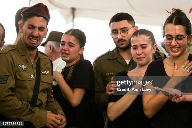 Friends and family mourn during the funeral of soldier, Adi Leon, killed in a ground opreation in the Gaza Strip, on November 1, 2023 in...