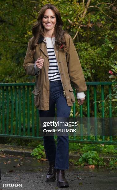 Britain's Catherine, Princess of Wales takes part in a 'Dad Walk' during a visit to "Dadvengers", a community for dads and their children, in north...