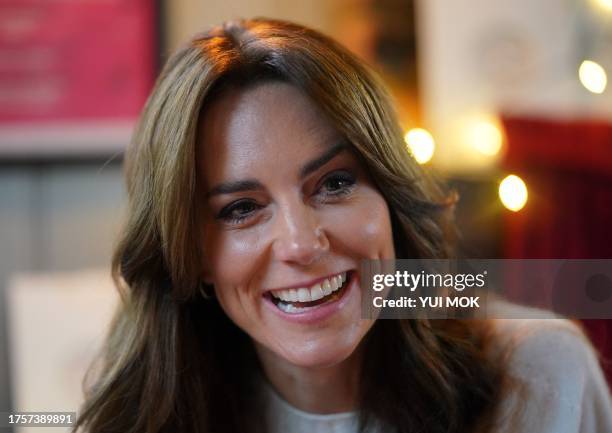 Britain's Catherine, Princess of Wales meets with members of the "Dadvengers", a community for dads and their children, in the Arnos Arms in north...