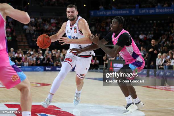 Issac Humphries of the Adelaide 36ers defended by Zylan Cheatham of the Breakers during the round five NBL match between New Zealand Breakers and...