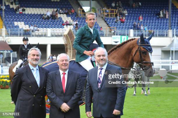 Kieran Mulvey, Michael Ring, Allen Bertram, Fonsie Mealy and Romanov congratulate Allen Bertram on his win at the RDS Dublin Horse Show 'Irish Sports...