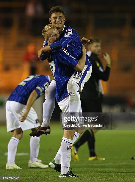 David Symington of Carlisle United is celebrates with Mark Beck after scoring the winning goal in the penalty shoot out during the Capital One Cup...