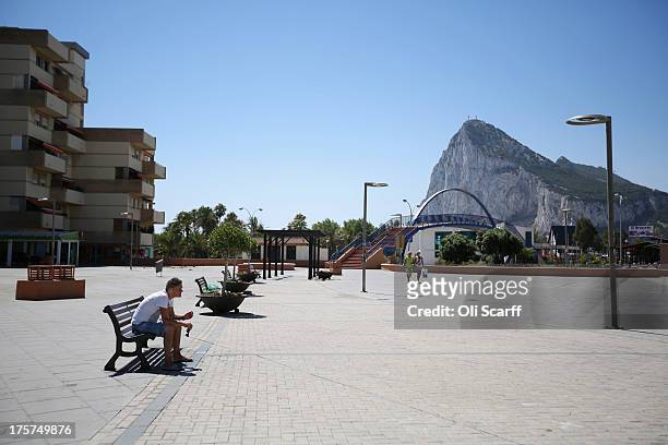Man relaxes on bench near the border between Spain and Gibraltar on August 7, 2013 in La Linea de la Concepcion, Spain. Following talks between...