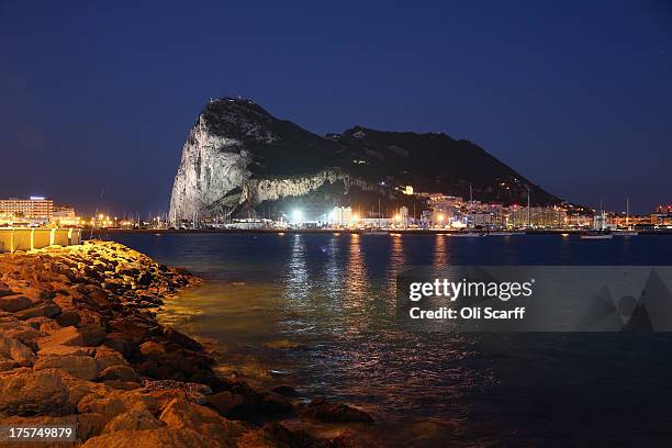 The Rock of Gibraltar is illuminated at night on August 7, 2013 in La Linea de la Concepcion, Spain. David Cameron and his Spanish counterpart,...