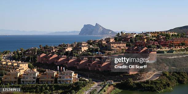 Modern apartments cover the hillside in front of the Rock of Gibraltar on August 7, 2013 in Alcaidesa, Spain. David Cameron and his Spanish...