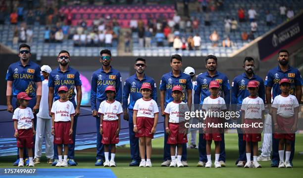 Players of Sri Lanka line up for the National Anthems ahead of the ICC Men's Cricket World Cup India 2023 between England and Sri Lanka at M....