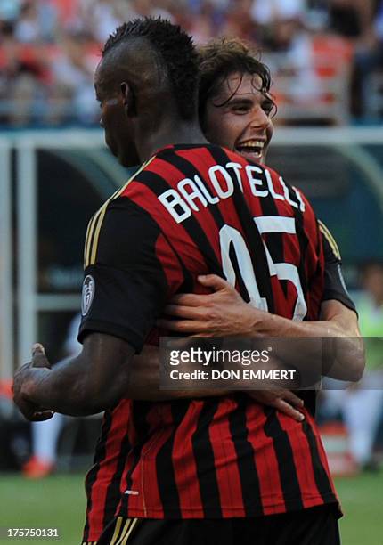 Mario Balotelli of AC Milan celebrates with teammate after scoring a goal against the LA Galaxy during the third place match of International...