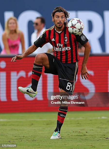 Cristian Zaccardo of AC Milan dribbles during the International Champions Cup Third Place Match against the Los Angeles Galaxy at Sun Life Stadium on...