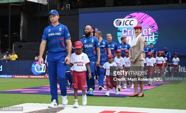 Jos Buttler of England makes their wway out for the National Anthems ahead of the ICC Men's Cricket World Cup India 2023 between England and Sri...
