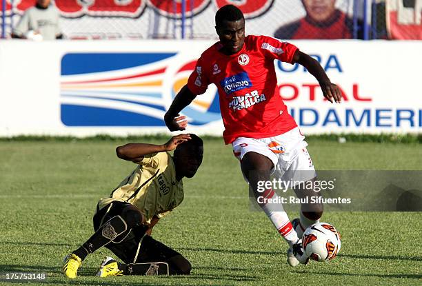 Christian Ramos of Juan Aurich fights for the ball with Erwin Maturana of Itagui during a match between Juan Aurich and Itagui as part of The Copa...