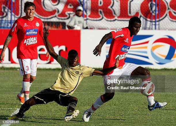 Christian Ramos of Juan Aurich fights for the ball with Erwin Maturana of Itagui during a match between Juan Aurich and Itagui as part of The Copa...