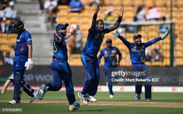 Angelo Matthews of Sri Lanka celebrates the wicket of Dawid Malan of England during the ICC Men's Cricket World Cup India 2023 between England and...