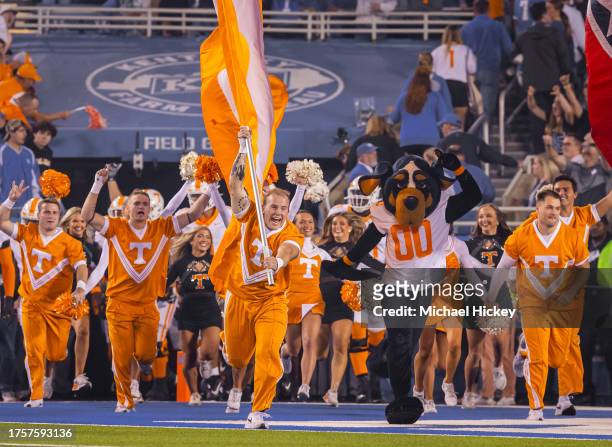 Tennessee Volunteers cheerleaders lead the team out on the field before the game against the Kentucky Wildcats at Kroger Field on October 28, 2023 in...