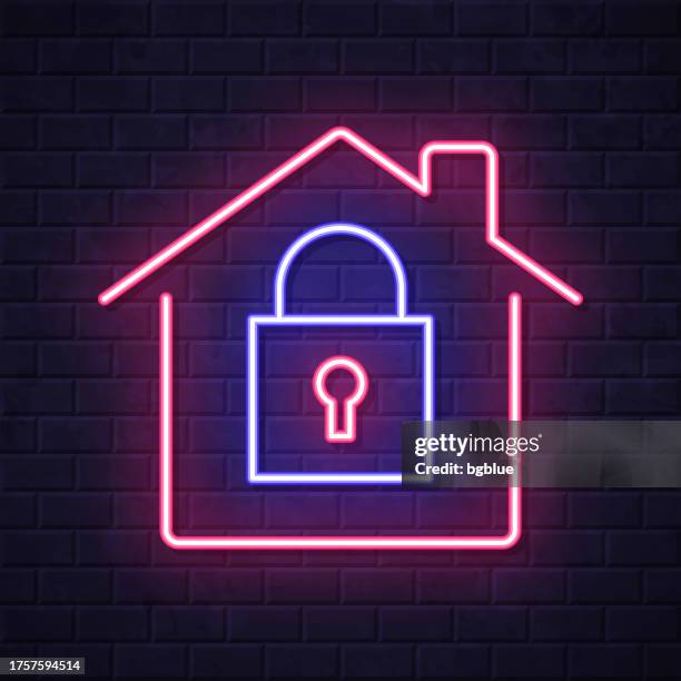 home security - house with padlock. glowing neon icon on brick wall background - electronic security systems stock illustrations