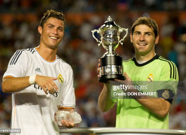 Real Madrid's Ronaldo and Iker Casillas hold their trophy after winning the 2013 International Champions Cup match between Real Madrid and Chelsea on...