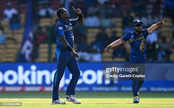 Angelo Matthews of Sri Lanka celebrates the wicket of Moeen Ali of England during the ICC Men's Cricket World Cup India 2023 between England and Sri...