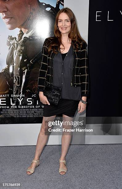 Actress Saffron Burrows arrives at the Premiere of TriStar Pictures' "Elysium" oat Regency Village Theatre on August 7, 2013 in Westwood, California.