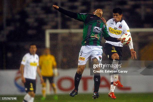 Esteban Pavez of Colo-Colo struggles for the ball with Pablo Lima of Tanque Sisley during a match between Colo-Colo and Tanque Sisley as part of the...