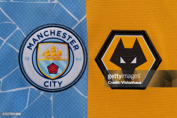 The Manchester City and Wolverhampton Wanderers club badges on October 12, 2023 in Manchester, United Kingdom.