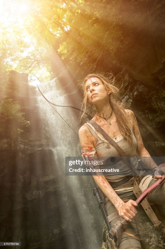 Female Heroine in the Jungle Hunting with Pick Axe