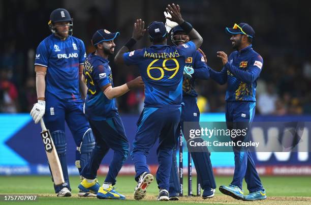 Kusal Mendis of Sri Lanka celebrates the run out wicket of Adil Rashid of England during the ICC Men's Cricket World Cup India 2023 between England...