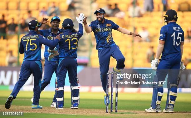 Kusal Mendis of Sri Lanka celebrates the run out wicket of Adil Rashid of England during the ICC Men's Cricket World Cup India 2023 between England...