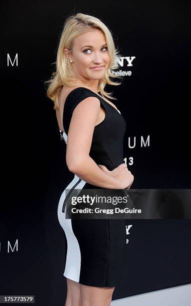 Actress Emily Osment arrives at the Los Angeles premiere of "Elysium" at Regency Village Theatre on August 7, 2013 in Westwood, California.