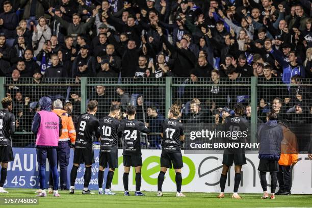 Genk's players celebrate after winning a Croky Cup 1/16 final game between URSL Vise and KRC Genk, in Vise, Wednesday 01 November 2023. BELGA PHOTO...