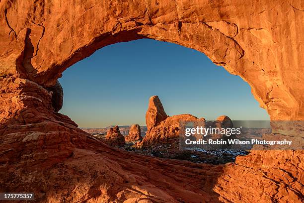 framed in stone - natural arch stock pictures, royalty-free photos & images