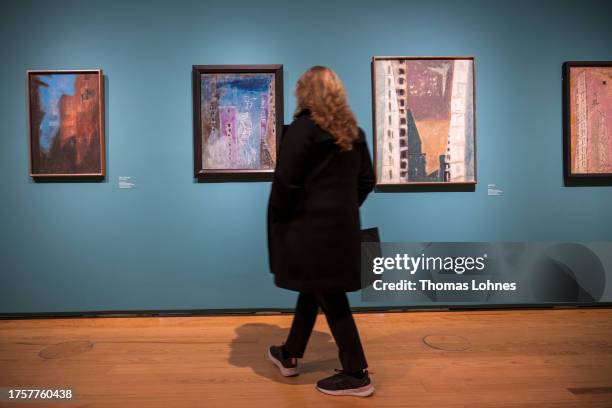 Woman looks to the painting 'Moonwake' during the exhibition press preview of "Lyonel Feininger. Retrospektive" at Schirn Kunsthalle on October 26,...