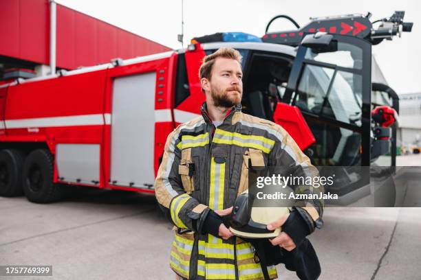 caucasian fireman at the fire station - firefighter getting dressed stock pictures, royalty-free photos & images