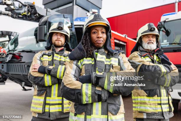 outdoor portrait of diverse firefighters - firefighter getting dressed stock pictures, royalty-free photos & images