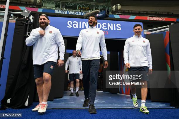Joe Marler , Courtney Lawes and Ben Youngs of England make their way out of the tunnel for their final international training session during the...