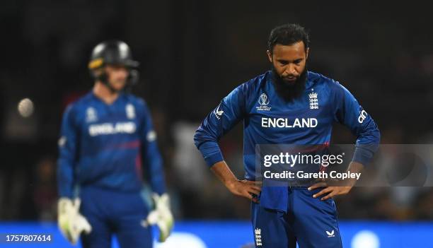 Jos Buttler and Adil Rashid of England react during the ICC Men's Cricket World Cup India 2023 between England and Sri Lanka at M. Chinnaswamy...