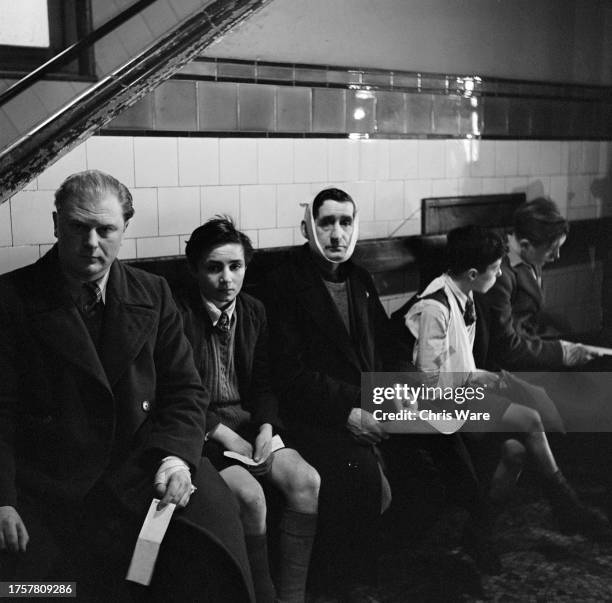 'Back surgery' patients wait to have wounds dressed after receiving treatment in the first surgery, also known as the 'front surgery', at Guy's...