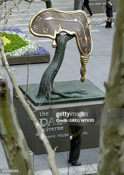 Giant sculpture entitled "Profile of Time", by Salvador Dali, stands outside Sydney's Customs House, 03 September, helping to promote a major new...