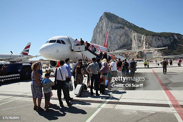 Passengers board a flight at Gibraltar International Airport on August 8, 2013 in Gibraltar. David Cameron has spoken with his Spanish counterpart,...